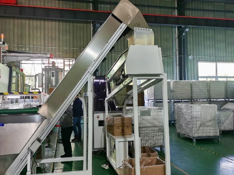 Industrial conveying equipment in a factory setting, used for handling materials.